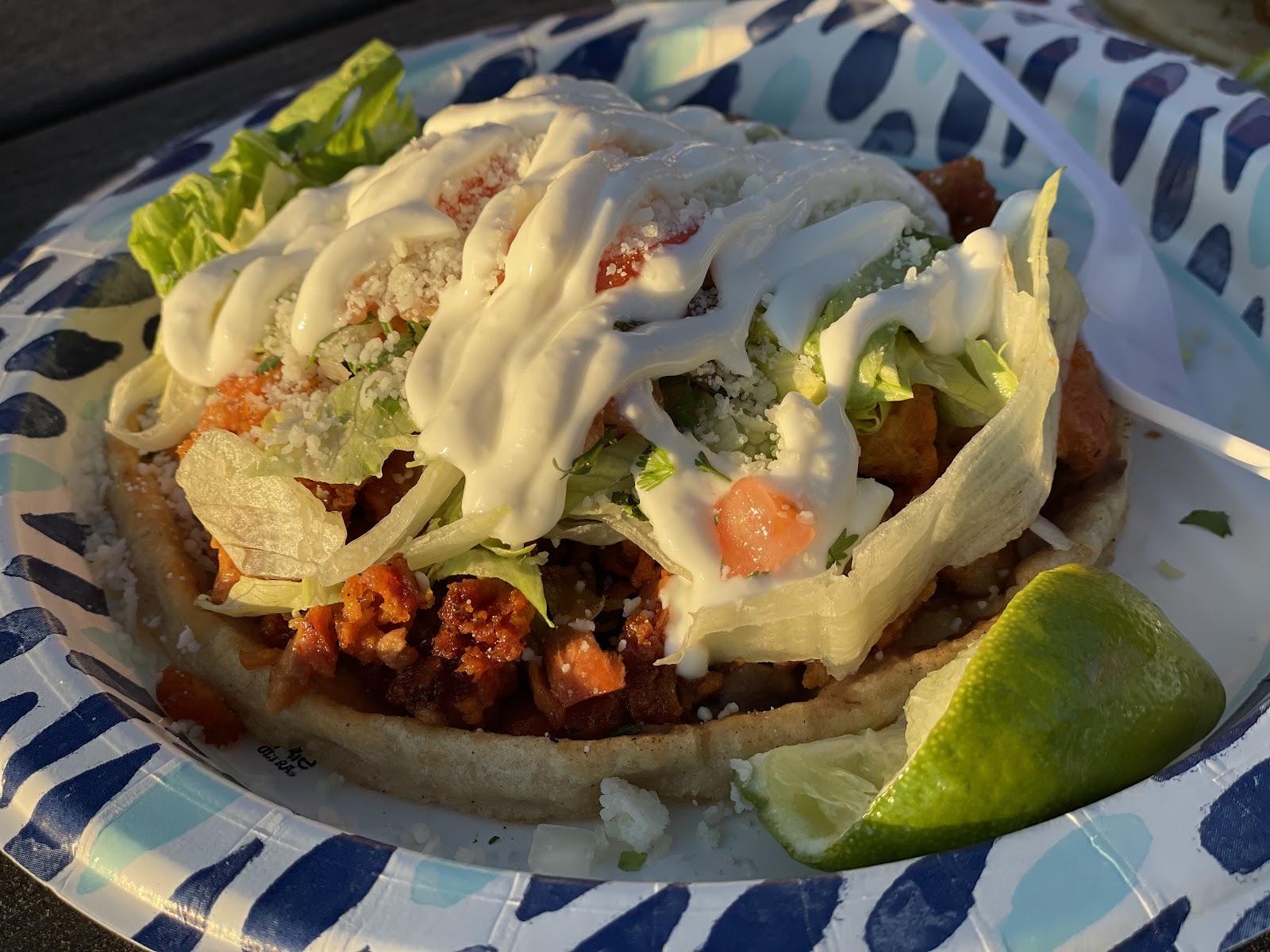 Tostada with crema and lime